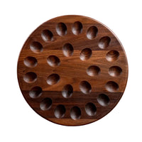 Wooden circular board with holes on a white background