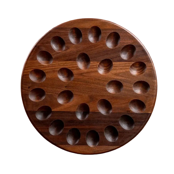 Wooden circular board with holes on a white background