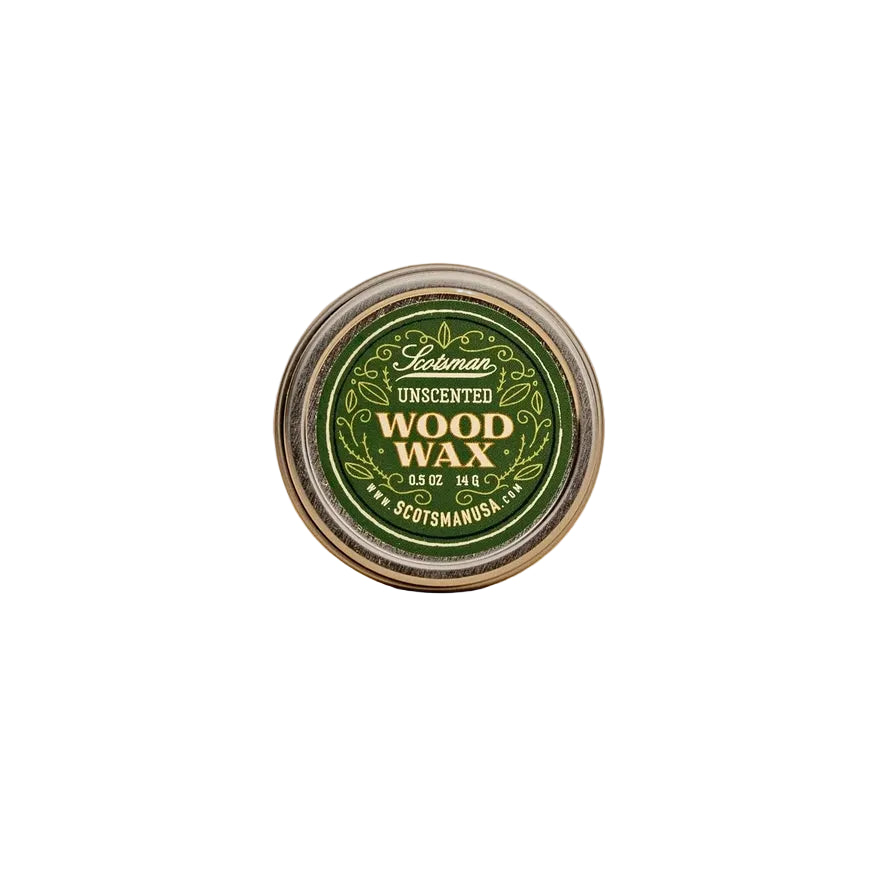 A round tin of Scotsman Unscented Wood Wax, featuring a green and gold label, set against a solid beige background.