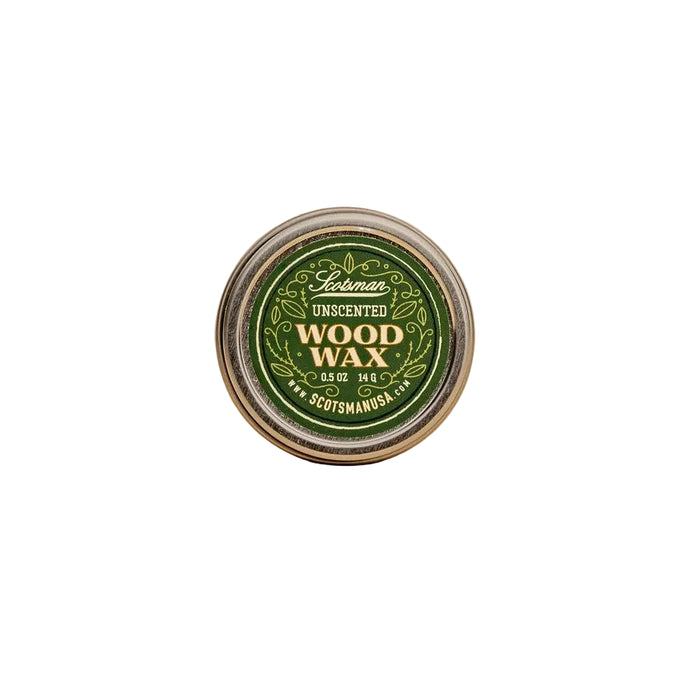A round tin of Scotsman Unscented Wood Wax, featuring a green and gold label, set against a solid beige background.
