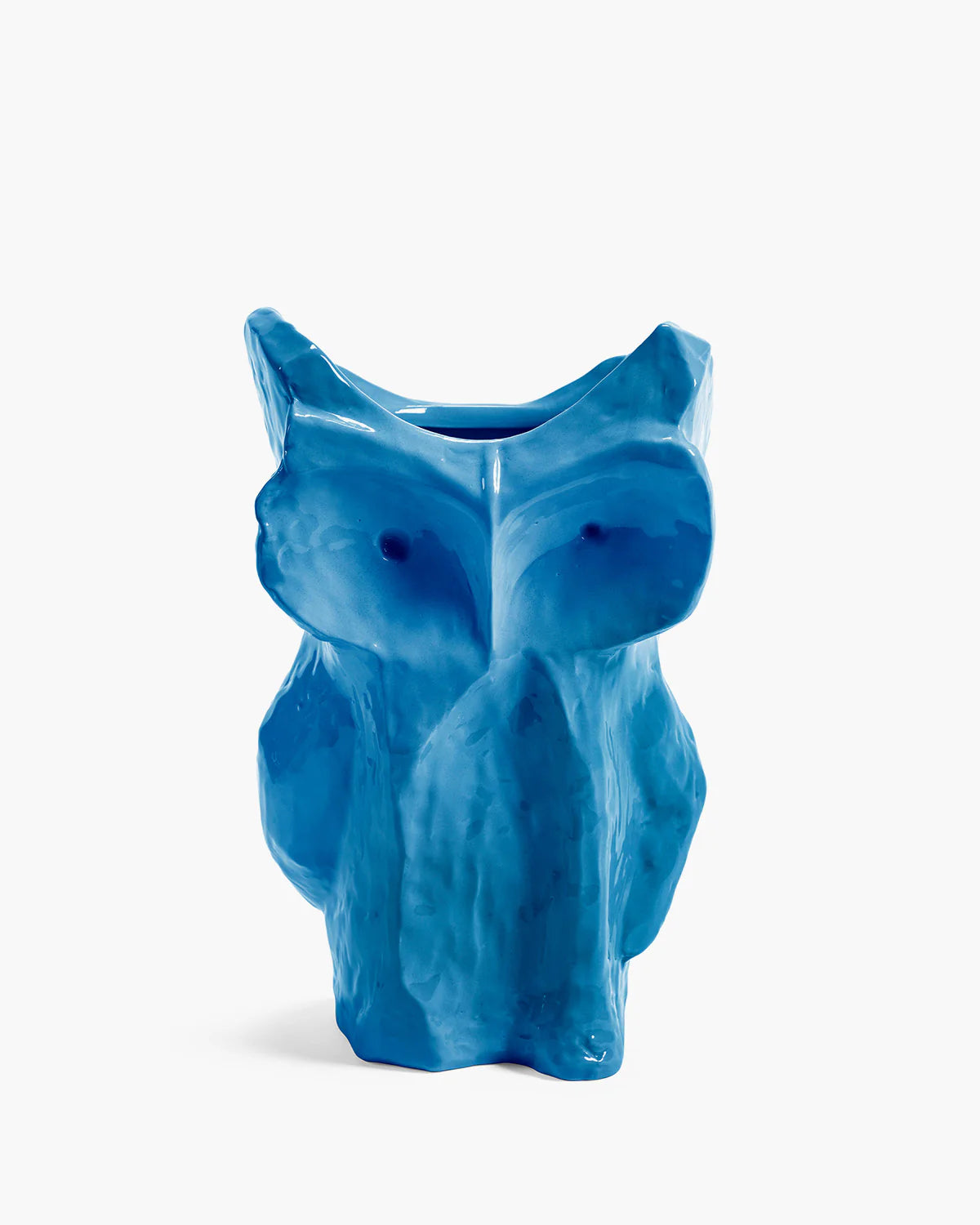 blue ceramic owl vase on white background