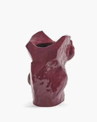 ceramic vase maroon color on white background