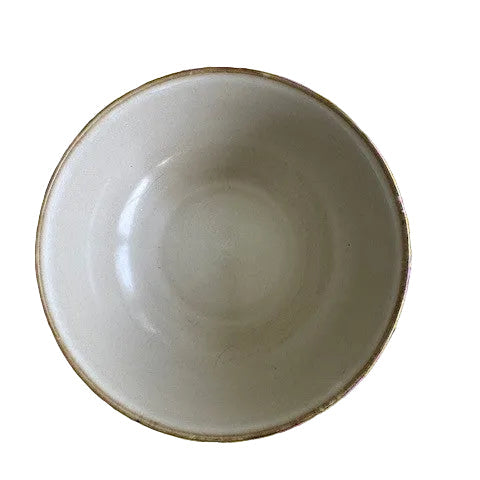 White bowl on a floral-patterned yellow background