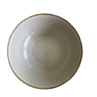 White bowl on a floral-patterned yellow background