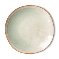 soft toned ceramic side plate on white background