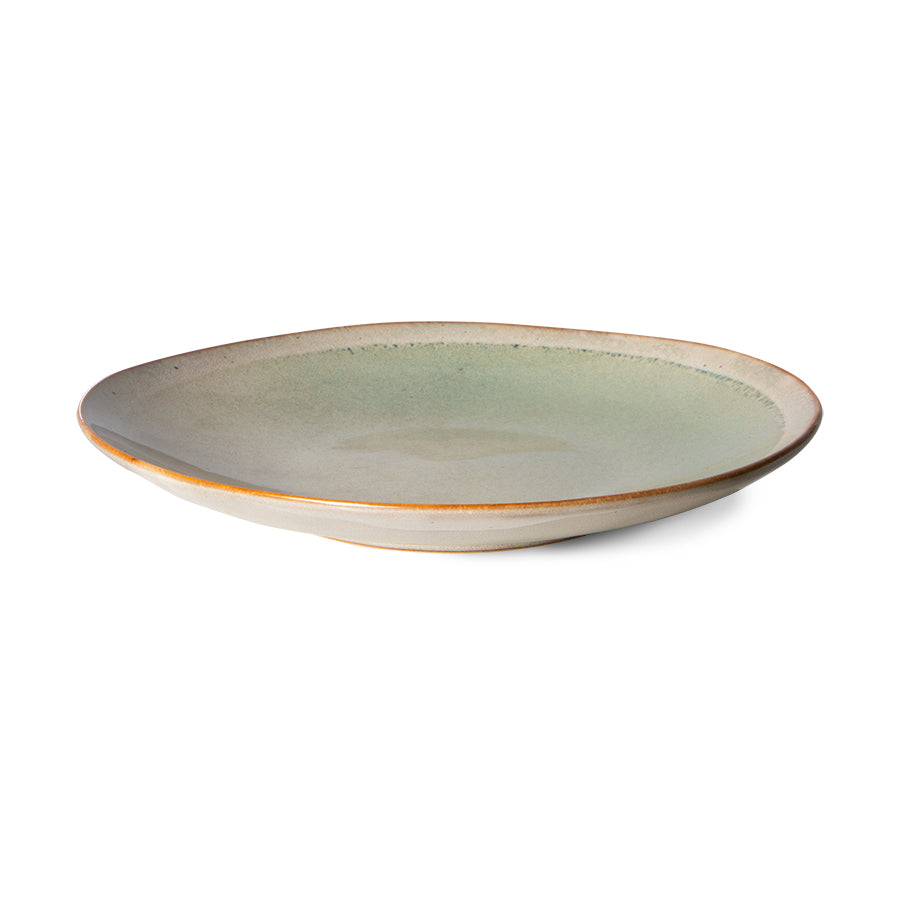 soft toned ceramic side plate on white background