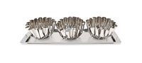 Set of three silver fluted bowls on a tray with a white background