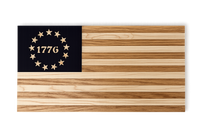 Wooden flag with striped design and '1776' on a black background