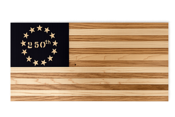 Wooden cutting board with a black section featuring stars and '250th' text on a black background