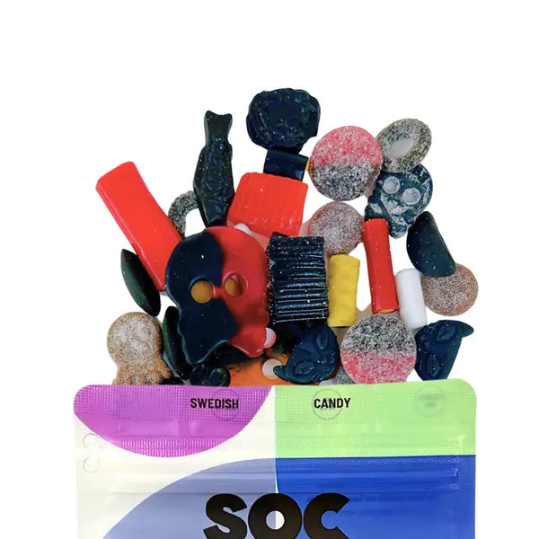 Assorted colorful Swedish Fish candy with packaging on a white background