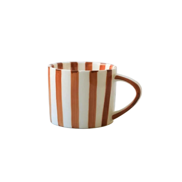 Striped ceramic mug on a white background