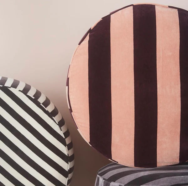 round velvet ottomans with bold stripes