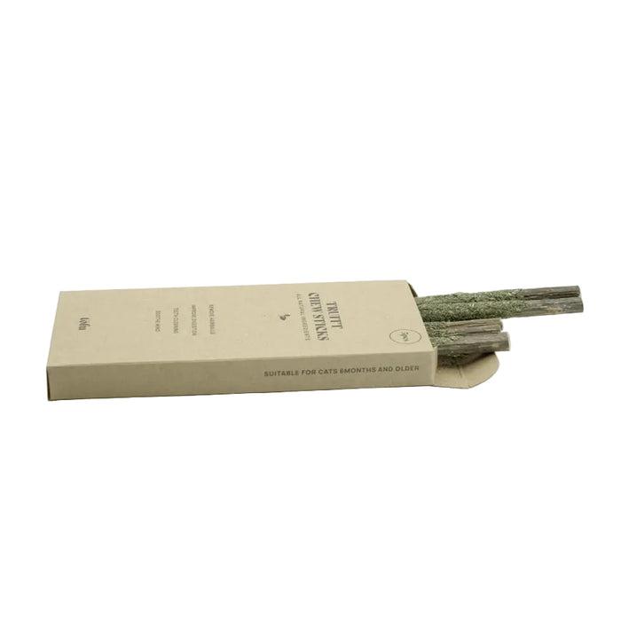 A kraft paper box containing natural wood chew treats for cats, shown on a clean white background.