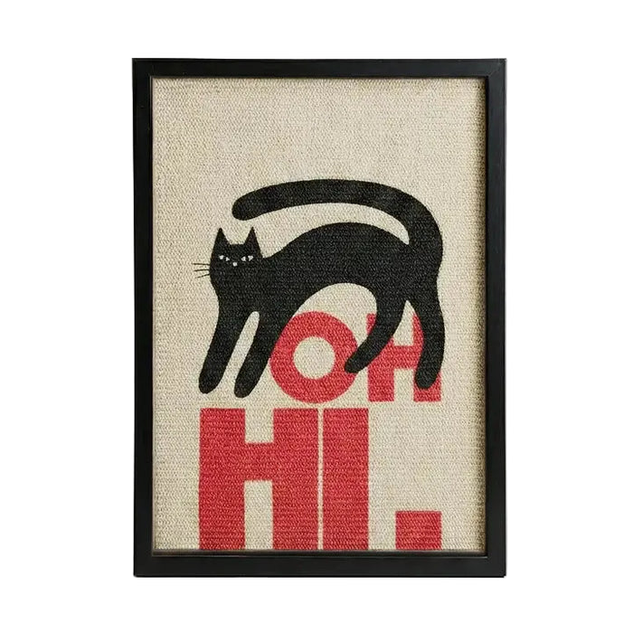 Framed wall art featuring a black cat silhouette walking over bold red letters spelling 'OH HI.' on a beige woven-texture background, shown in a black frame against a light gray studio backdrop.