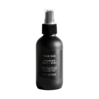 Black spray bottle labeled 'True Hue' on a white background