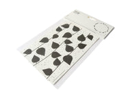 Card with black leaf patterns on a white background