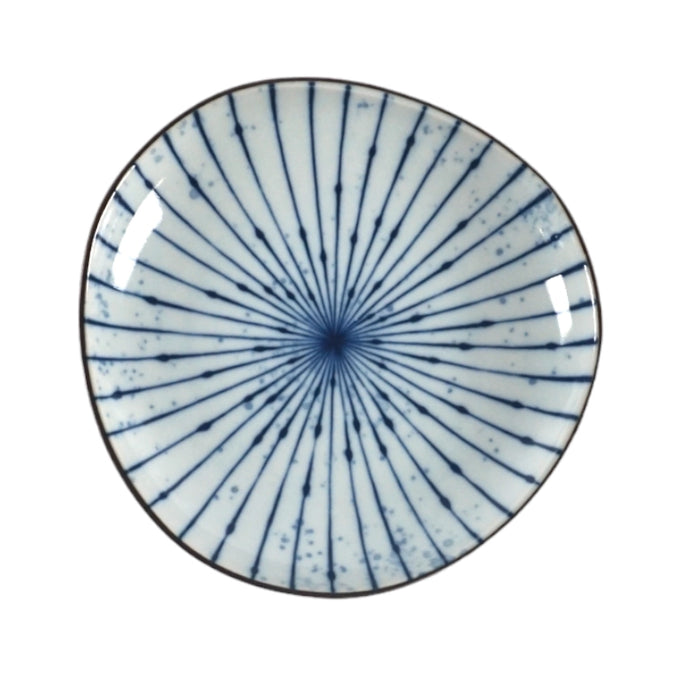 Ceramic plate with blue radial pattern on a white background