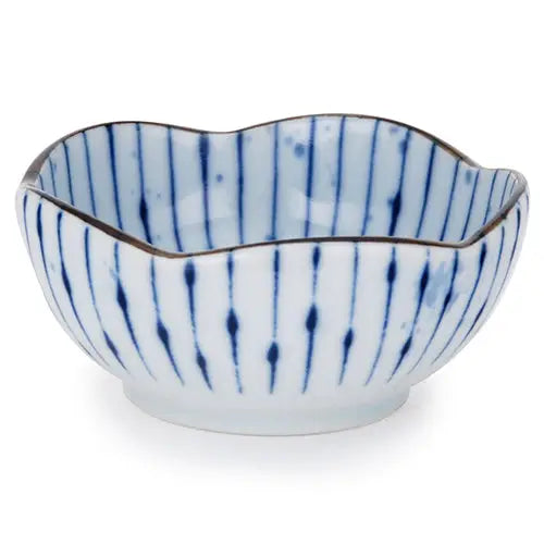 Ceramic bowl with blue striped pattern on a white background