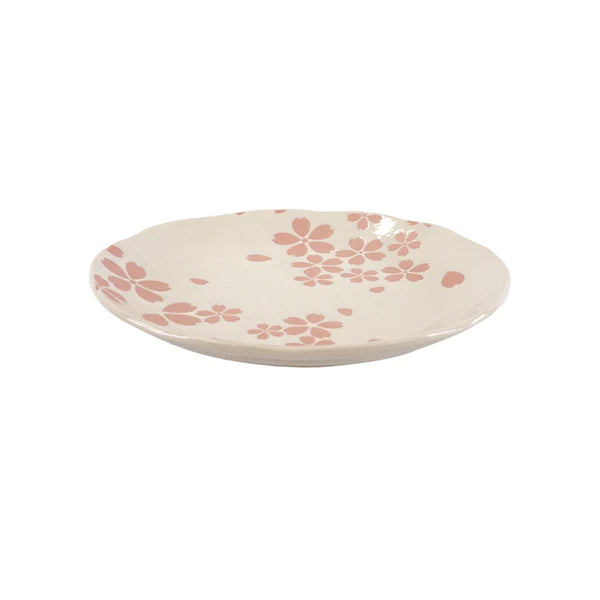 Ceramic plate with pink floral pattern on a white background
