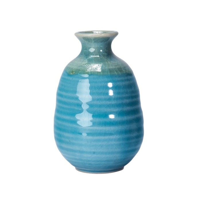 Blue ceramic vase on a white background