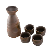 Set of brown ceramic sake bottles and cups on a white background