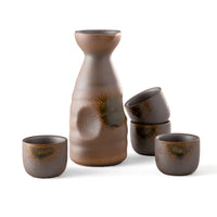 Set of brown ceramic vessels including a bottle and four cups on a white background