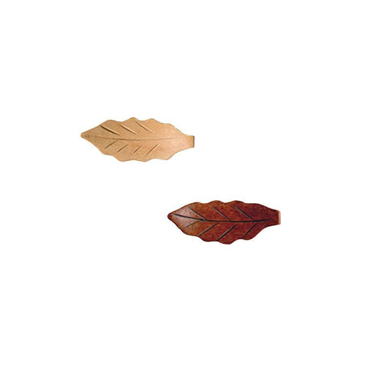 Two leaf-shaped wooden knobs on a white background