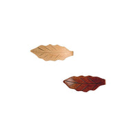 Two leaf-shaped wooden knobs on a white background