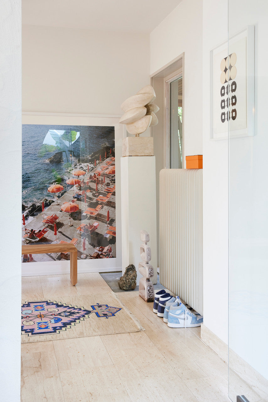 framed photo of orange parasols at Amalfi Coast in hallway