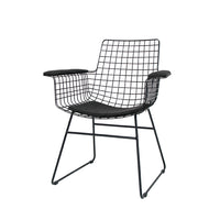 black metal wire chair with seating cushion in charcoal on white background