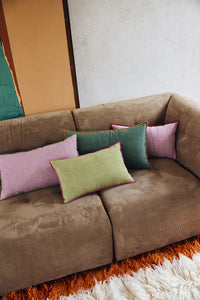brown corduroy element couch with pink and green lumbar pillows in two sizes