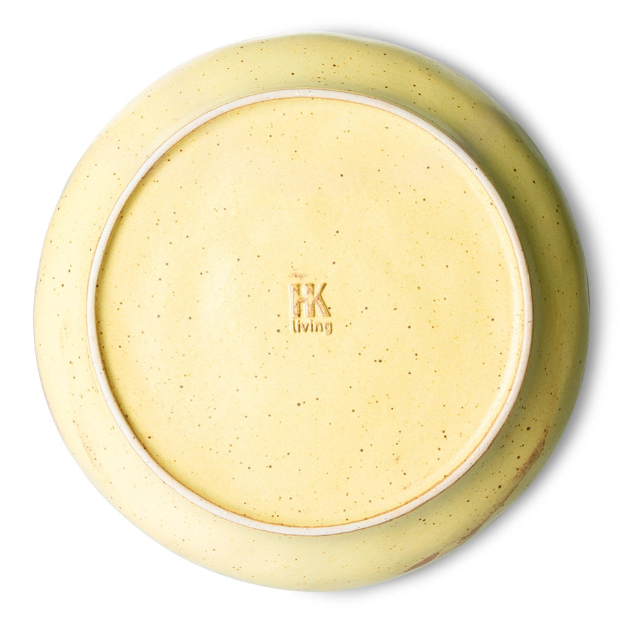 back of deep porcelain plate yellow and brown color