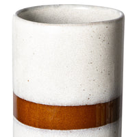 detail of a tall retro style flower vase made from stoneware. White with a brown horizontal stripe