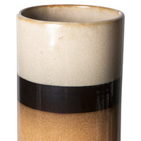 detail of cream brown and orange peach colored tall retro style flower vase