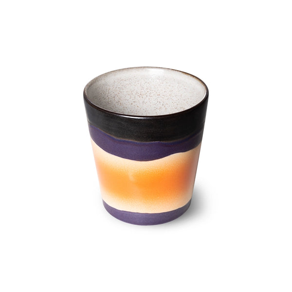 cream white, black, brown orange and lavender colored small stoneware coffee cup in retro style