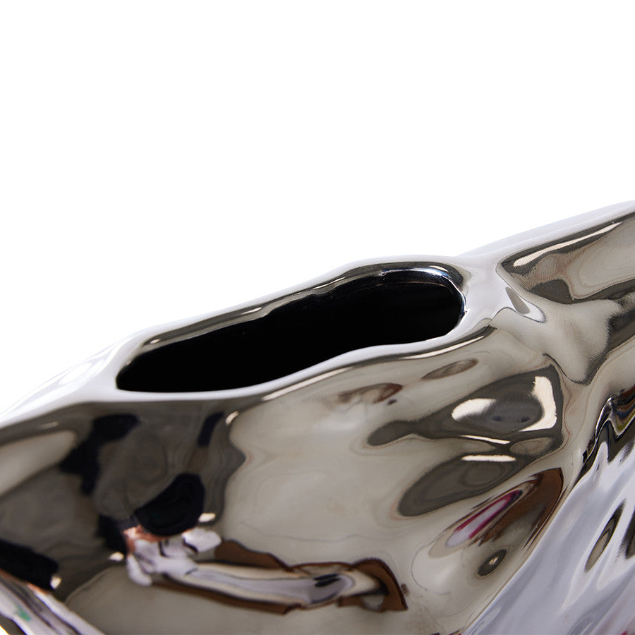 detail of bag of chips silver vase object