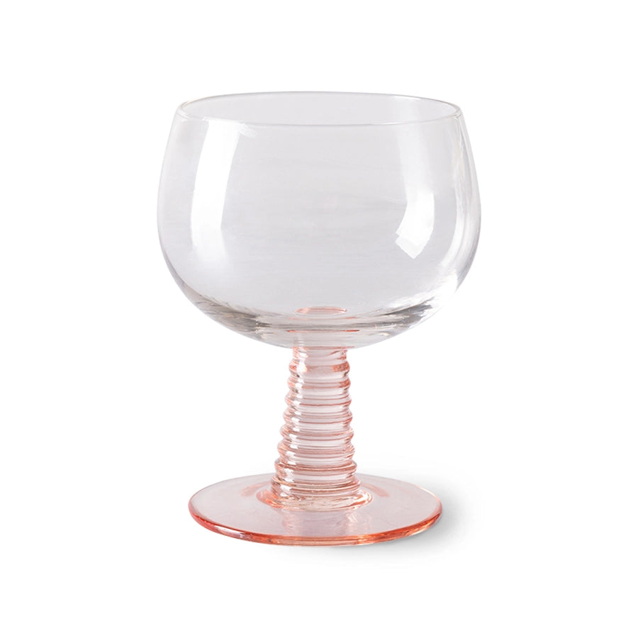 low stem wine glass with a pink foot