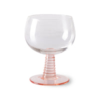 low stem wine glass with a pink foot
