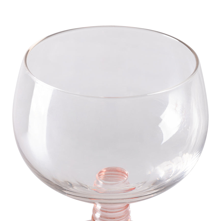 low stem wine glass with a pink foot