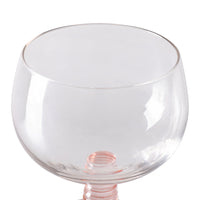low stem wine glass with a pink foot