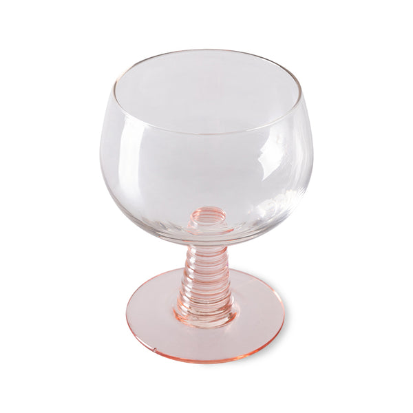 low stem wine glass with a pink foot