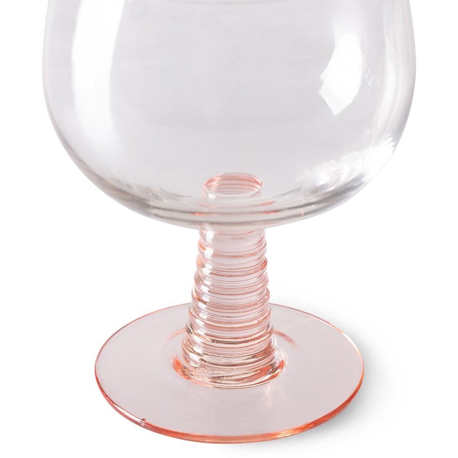 low stem wine glass with a pink foot