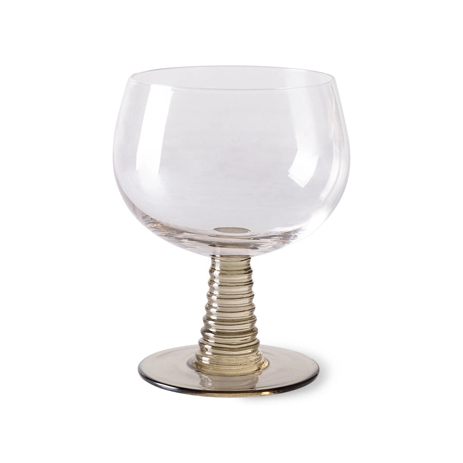wine glass with a green colored low stem 