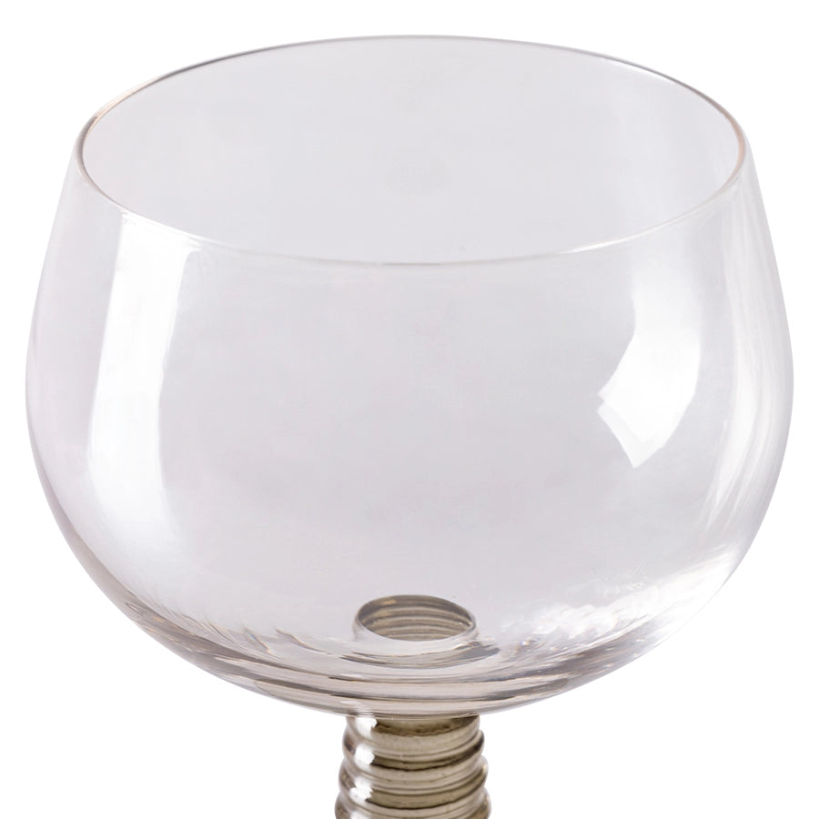 wine glass with a green colored low stem 