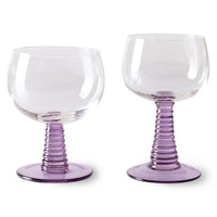 purple colored low and high stem wineglass