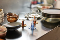 retro style wineglasses with red and blue stems