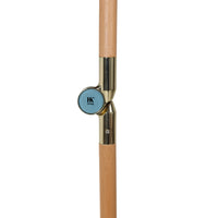 detail of pole from the retro style parasol with flower fabric and blue fringes