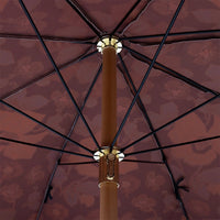 inside of retro style parasol with flower fabric and blue fringes