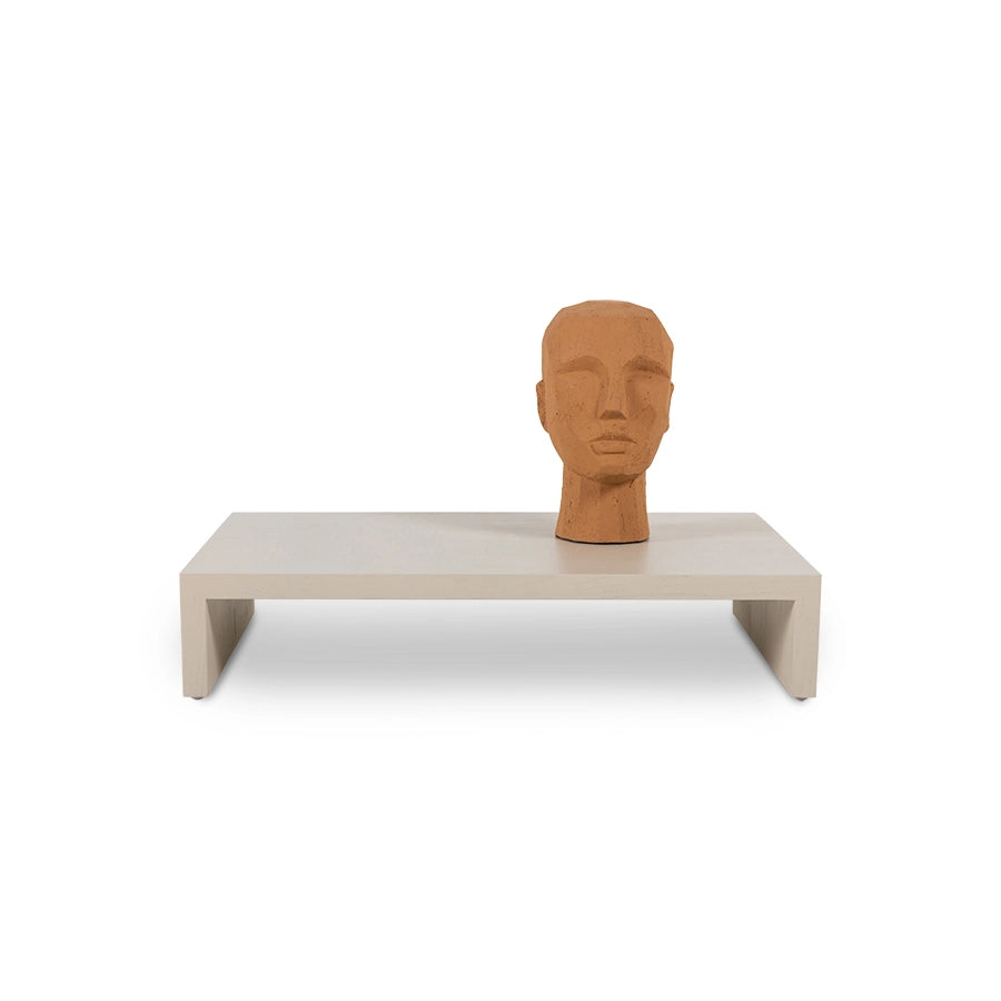  sand colored wooden low plateau table with terracotta head sculpture