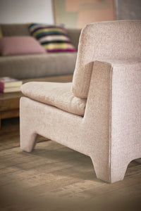 back of blush mélange colored fabric lounge chair
